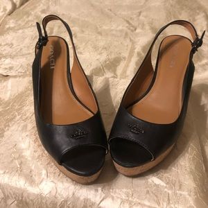 Coach black leather wedges.